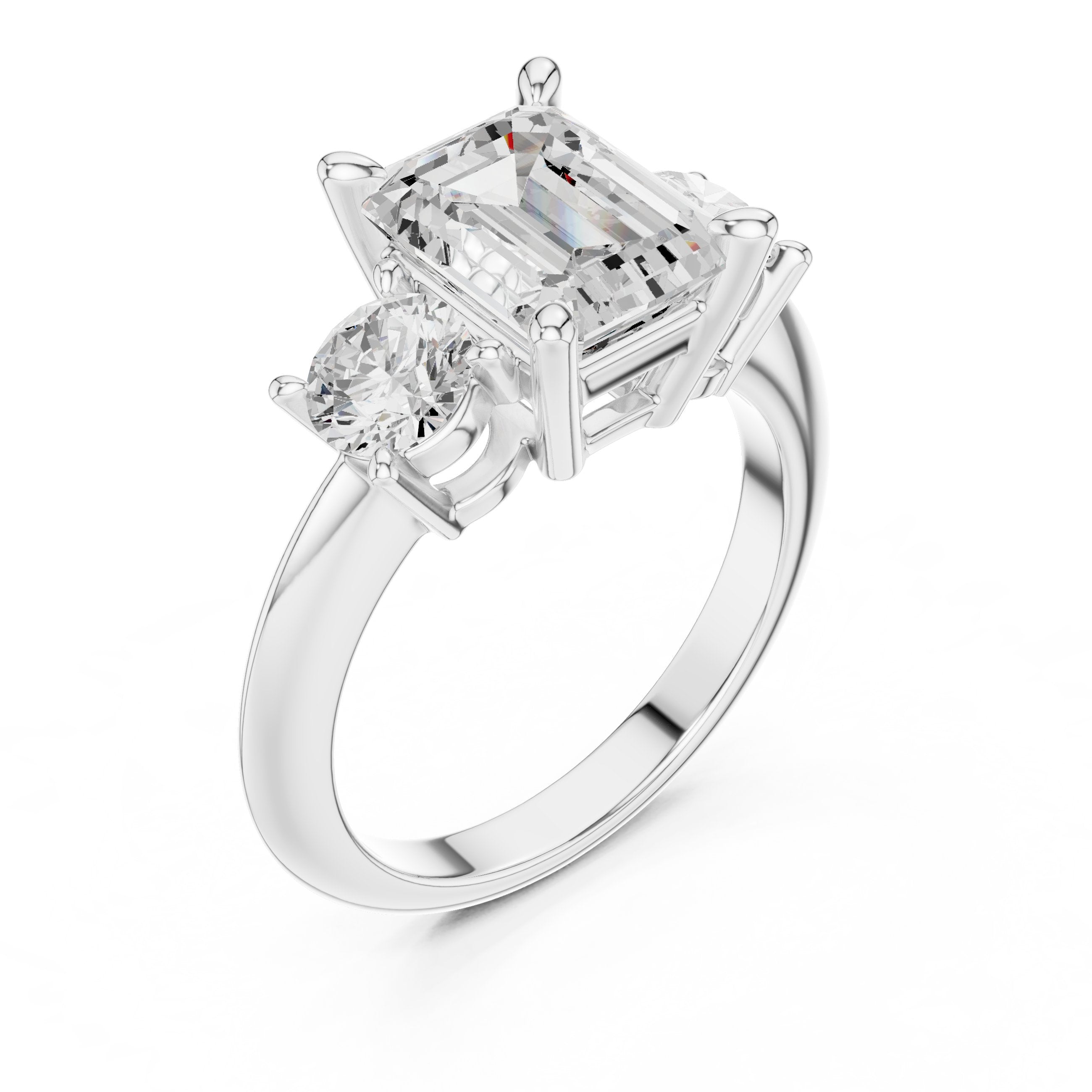 Emerald Cut Three Stone Engagement Ring with Round Sides in White Gold - VYKA Diamonds