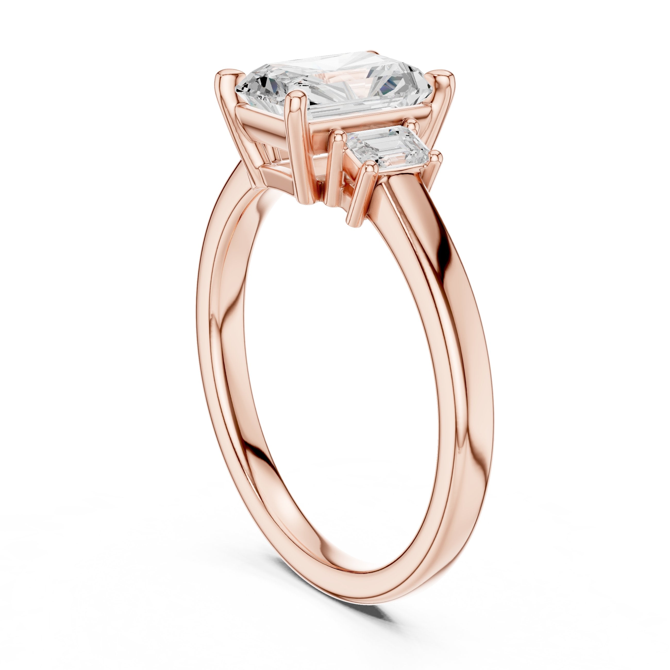 Radiant Cut Three Stone Engagement Ring with Emerald Sides in Rose Gold - VYKA Diamonds