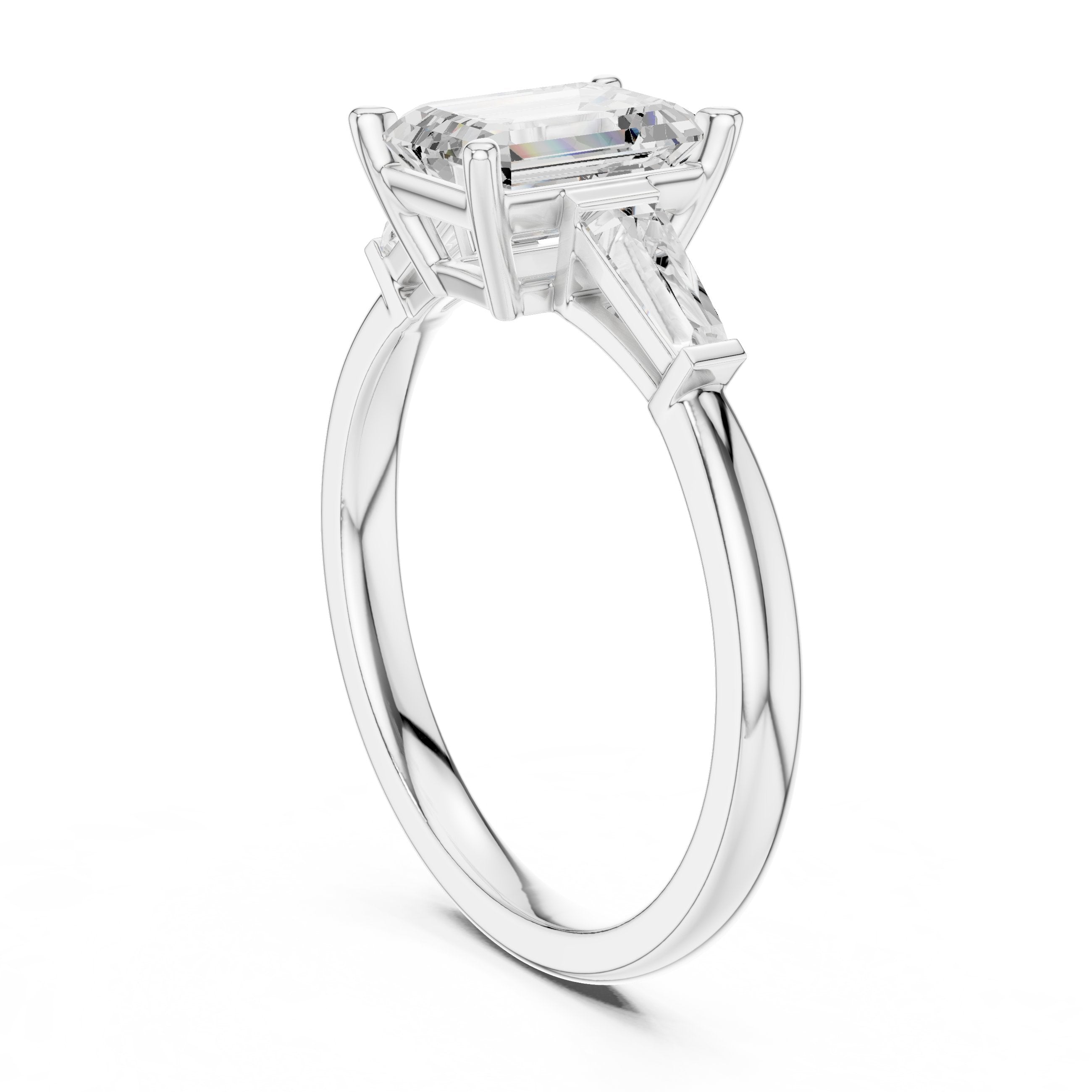 Emerald Cut Three Stone Engagement Ring with Tapered Baguette Sides in White Gold - VYKA Diamonds
