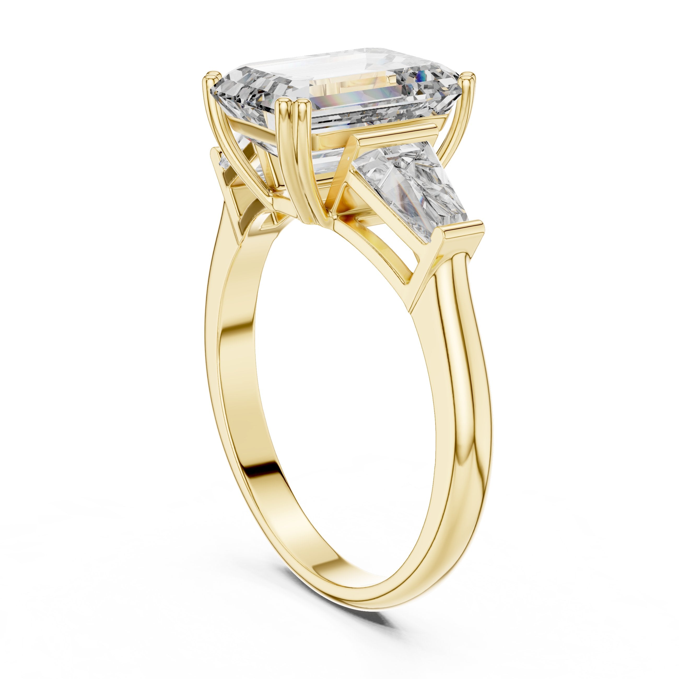 Emerald Cut Three Stone Engagement Ring with Tapered Baguette Sides in Yellow Gold - VYKA Diamonds
