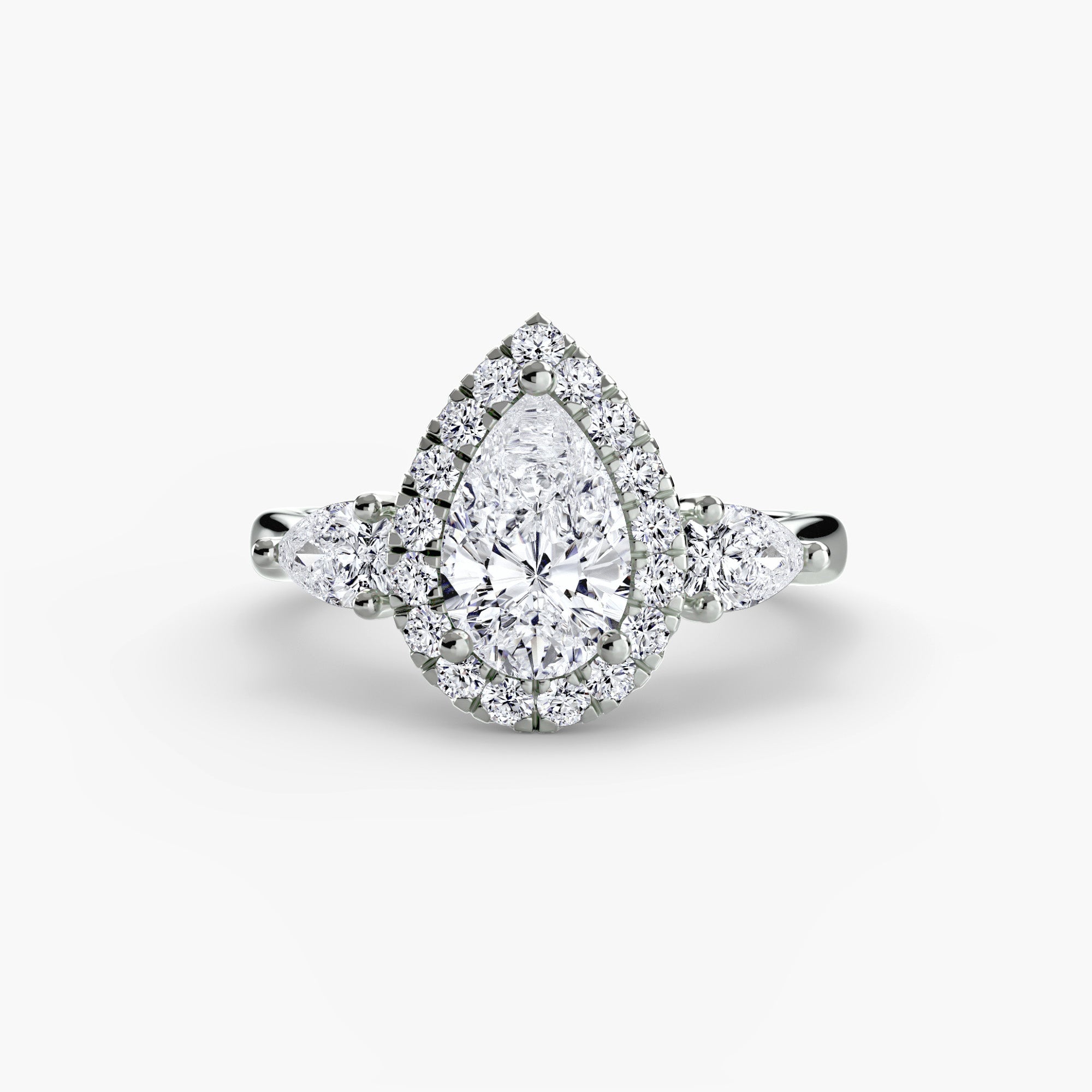 Three-Stone Ring with Halo - diamond engagement ring - VYKA Diamonds
