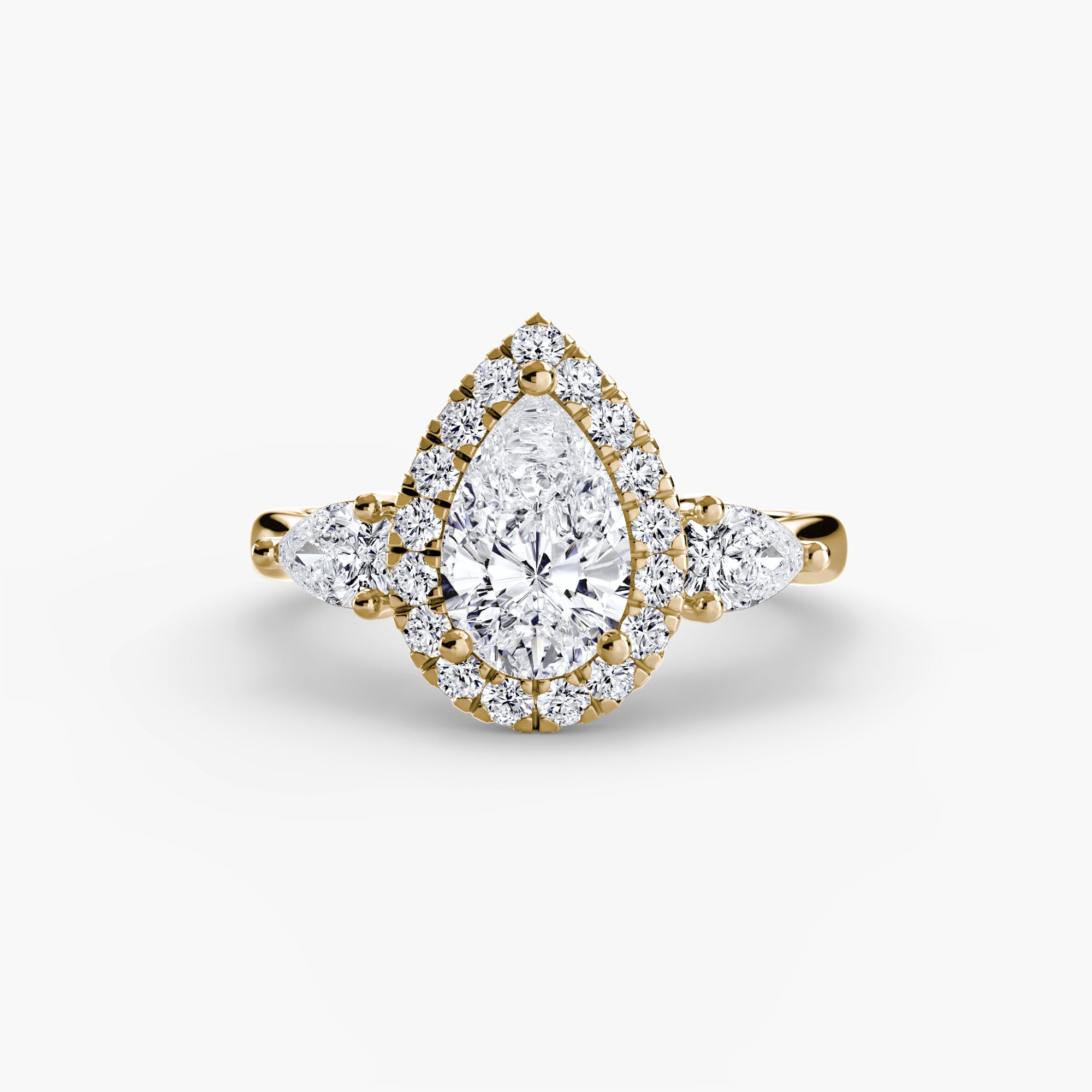 Three-Stone Ring with Halo - diamond engagement ring - VYKA Diamonds