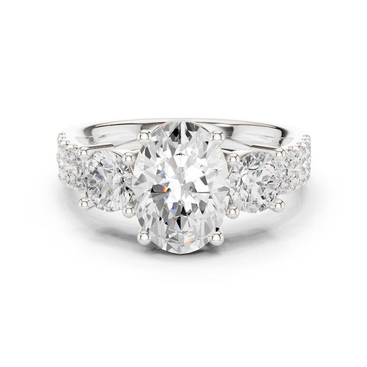 Oval Diamond Three Stone Engagement Ring with Round Sides and Pavé Band